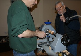 Paul demonstrating the sphere jig. I wonder what Ken's gesture means